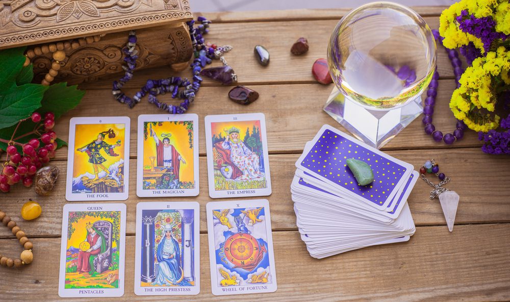 Europe, Ukraine. Kiev July 29: Illustrative Editorial. Tarot card on a table, White magic, attributes for witch, magic for love, health, attracting happiness . Esoteric concept