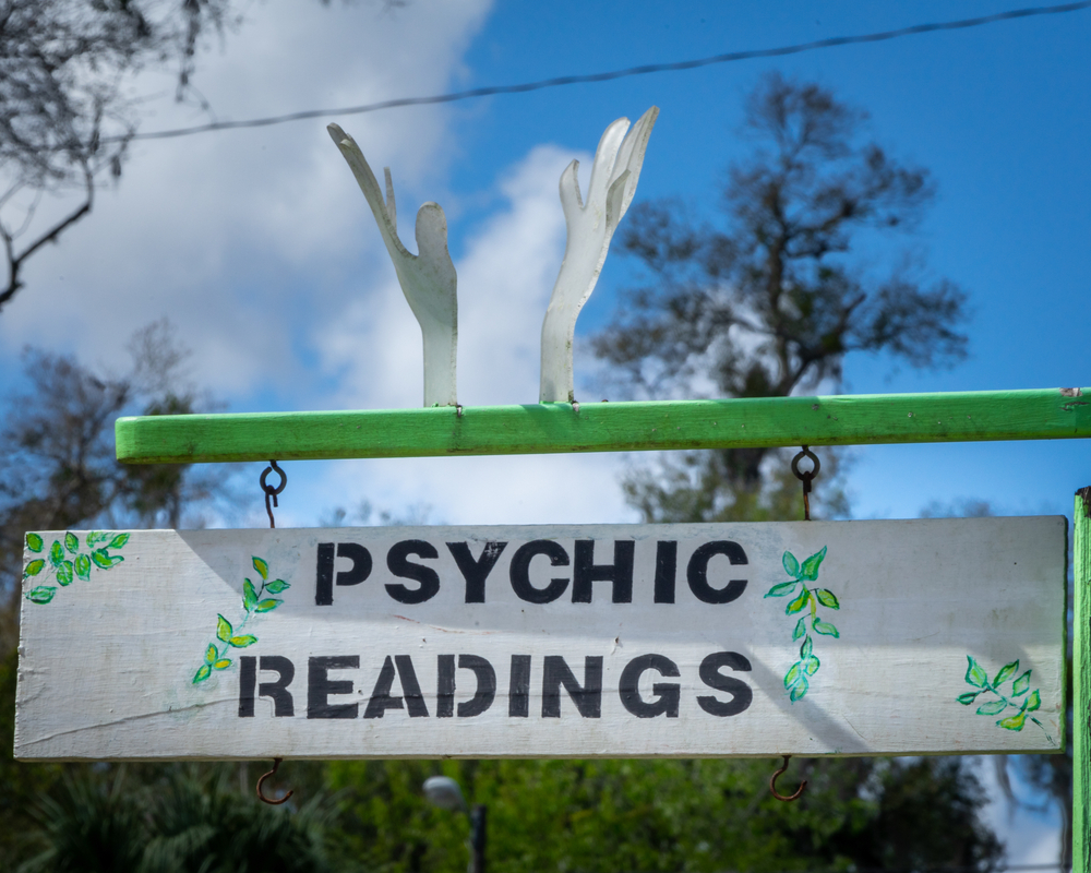 Psychic reading sign with blue skies in the background